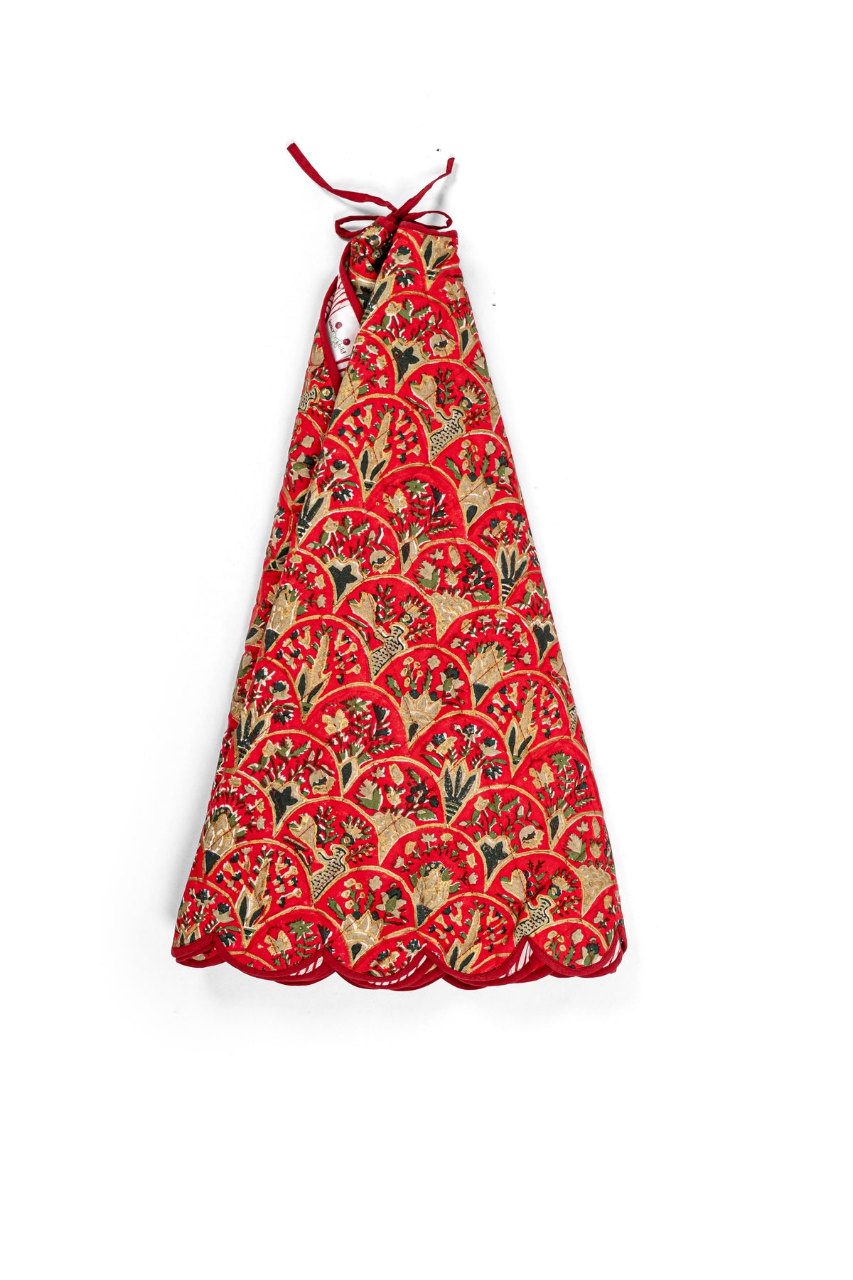 Red Holiday Arch blockprint quilted tree skirt folded into a triangle