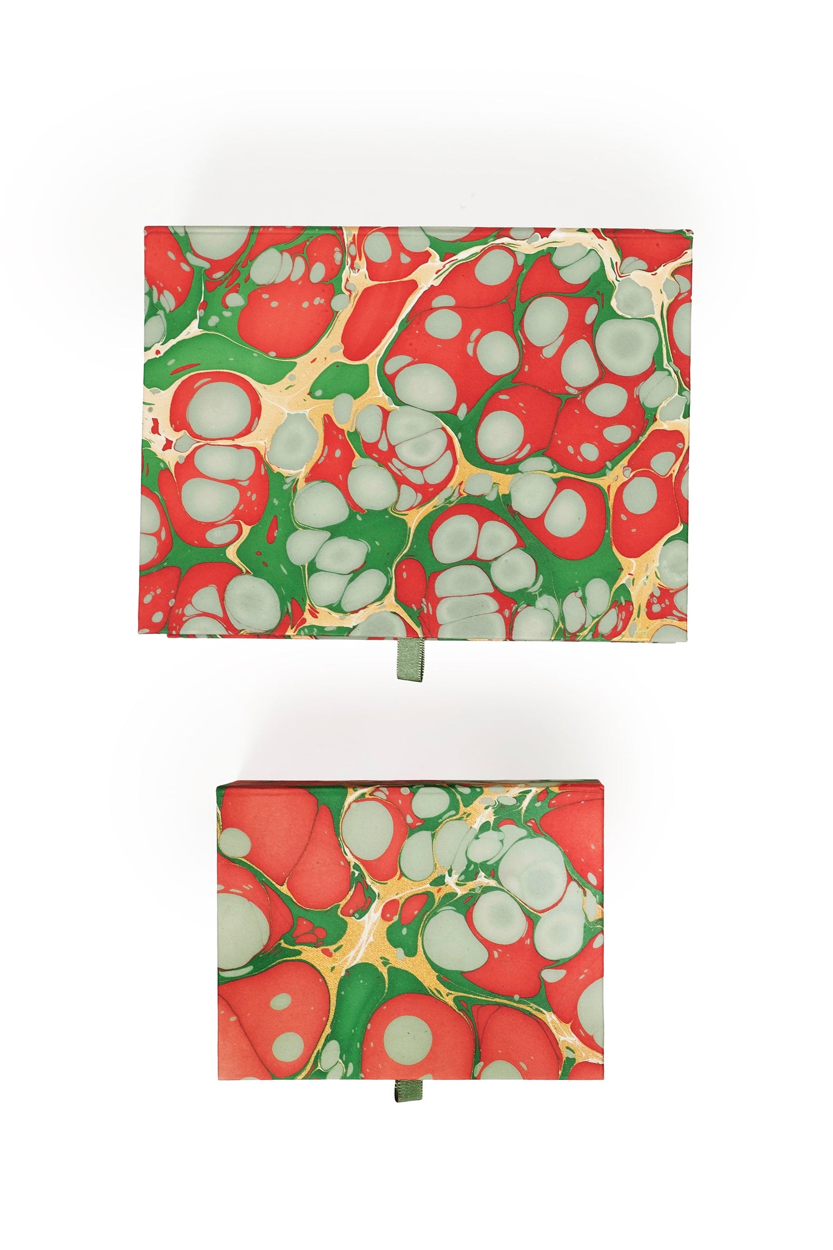 Hand-marbled keepsake box set in Christmas gems pattern with red, green, and white swirls, displaying lids with ribbon pulls.