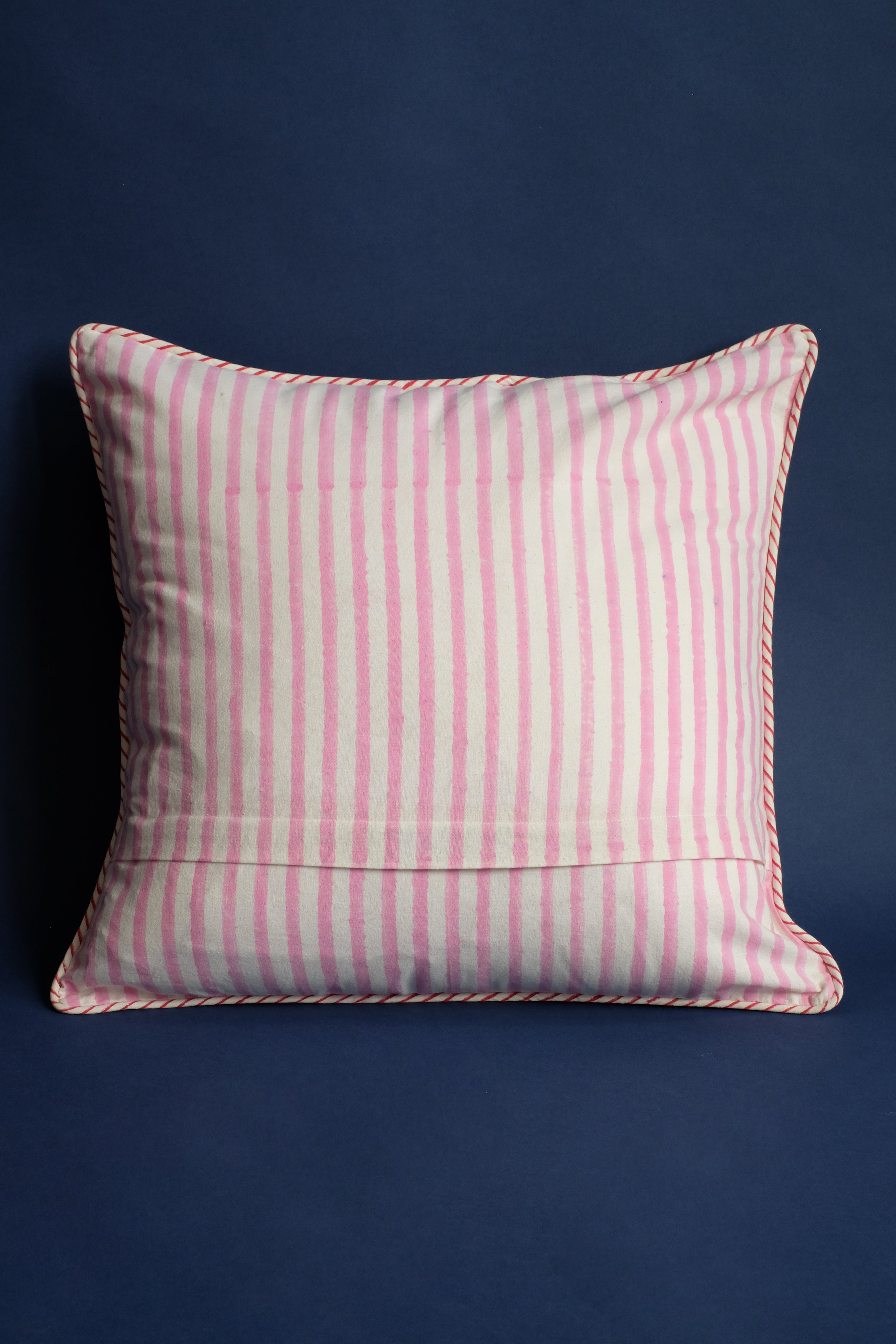 Pink striped blockprint pillow with red trim, New York design studio
