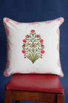 Pink scallop-floral blockprint throw pillow on red chair - Inner Child