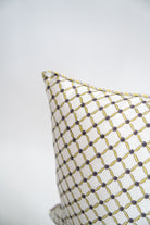 Yellow and gray geometric patterned decorative pillow detail