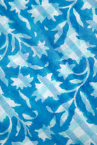 Close-up of blue organic cotton blockprint fabric showing detailed floral patterns, Inner Child
