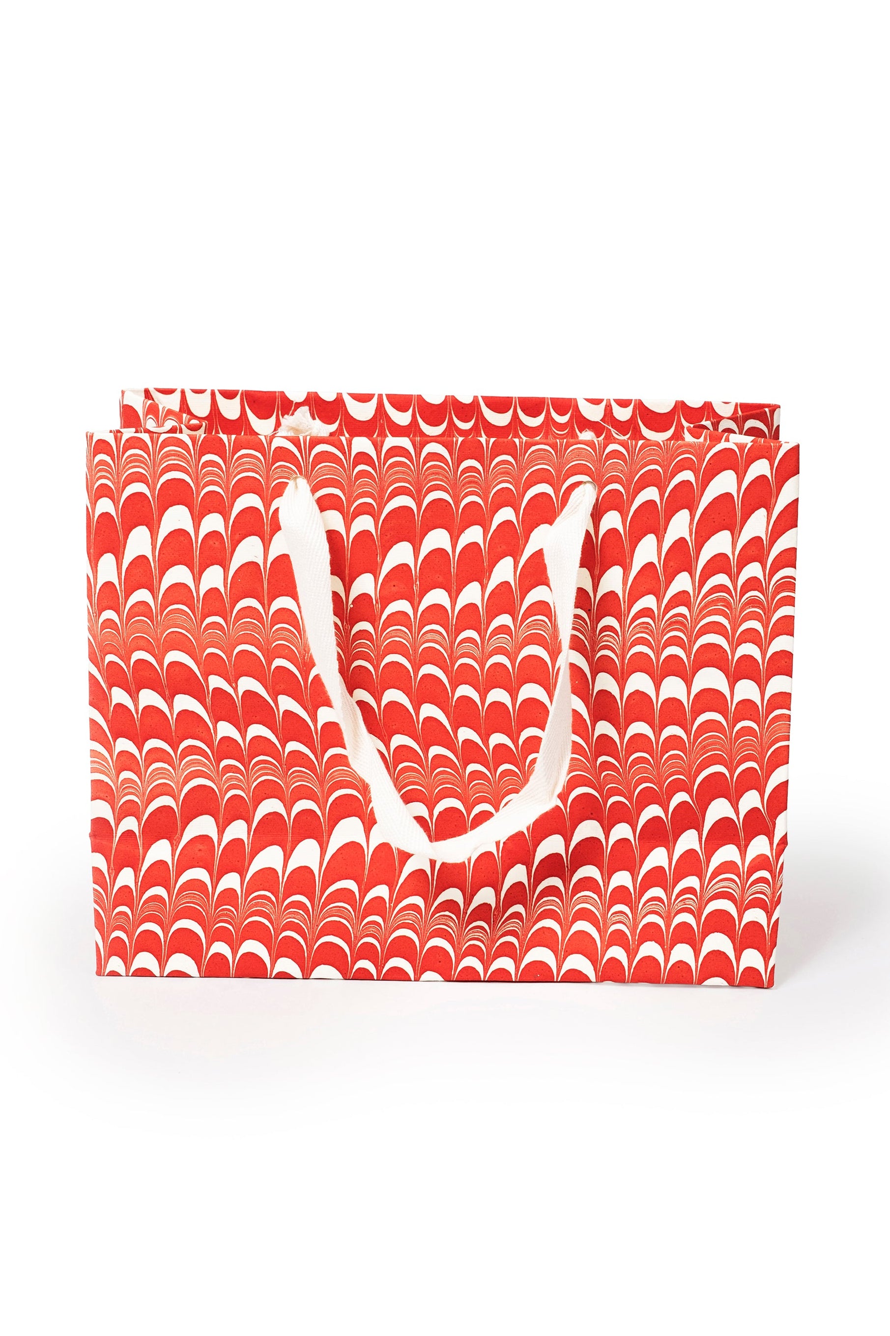 Medium red and white candy cane swirl hand marbled gift bag with white handles by Inner Child